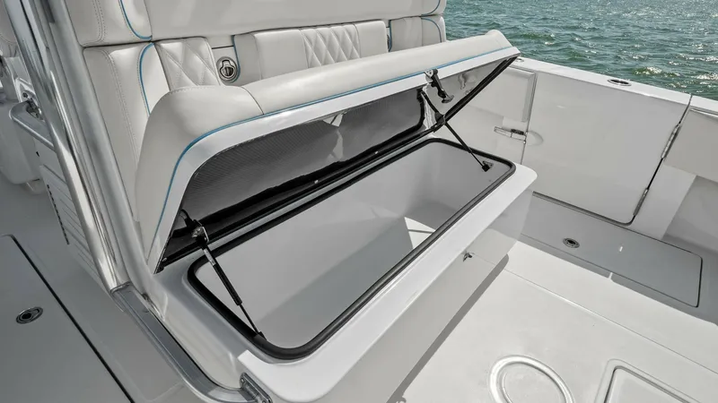 Slide: The Image of Aft Deck Seating with Storage This image showcases the versatile aft deck seating of the 2024 Sea Hunter 35 Tournament, featuring an integrated storage compartment. The seating is upholstered in premium materials, offering both comfort and functionality. With easy access to spacious s - 7094866