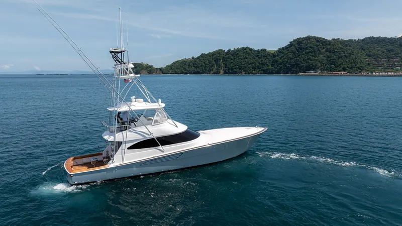 Slide: The Image of Starboard View of Viking 64 Convertible The 2024 Viking 64 Convertible, 'Fish Tank', showcases its sleek profile and advanced design from a starboard perspective. The modern hull glides gracefully through the water, highlighting its superior craftsmanship. This vessel is equipped with a spaciou - 7162616