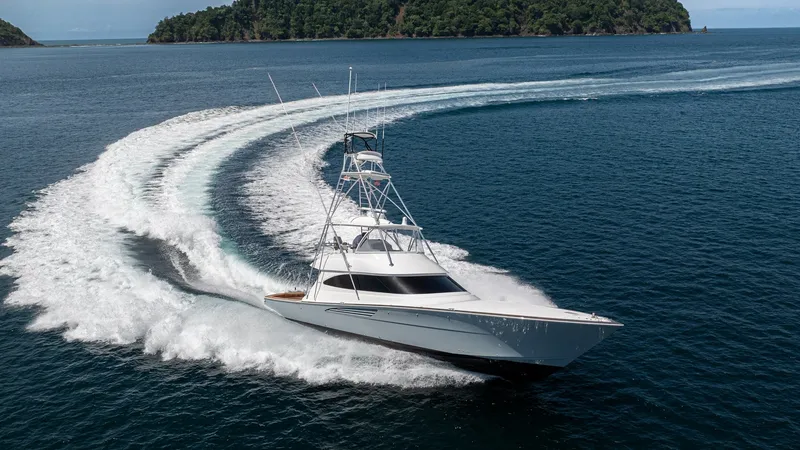 Slide: The Image of Viking 64 Convertible Cruising at Speed The 2024 Viking 64 Convertible 'Fish Tank' showcases its sleek design and powerful performance as it carves through open waters. The sharp bow and elegant lines highlight its advanced engineering, while the spacious flybridge offers commanding views. Idea - 7162628