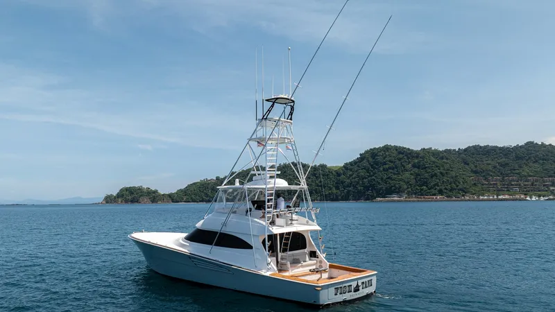 Slide: The Image of Aft View with Tower and Cockpit This image showcases the impressive aft view of the 2024 Viking 64 Convertible, Fish Tank. The vessel features a spacious cockpit designed for sportfishing, complete with a sturdy tower for optimal visibility. Its sleek lines and robust construction highl - 7162613