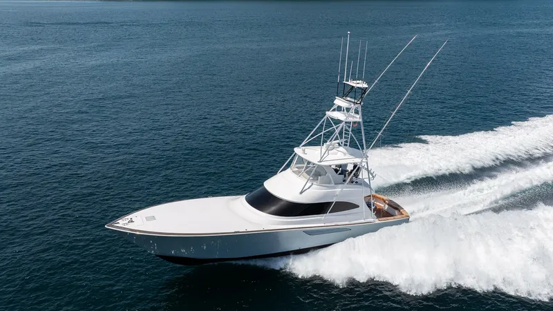 Slide: The Image of Viking 64 Convertible Cruising View The 2024 Viking 64 Convertible 'Fish Tank' showcases its sleek exterior design as it cruises effortlessly through open waters. The streamlined hull and advanced tower setup emphasize its prowess in sportfishing and luxury cruising. This model combines per - 7162624