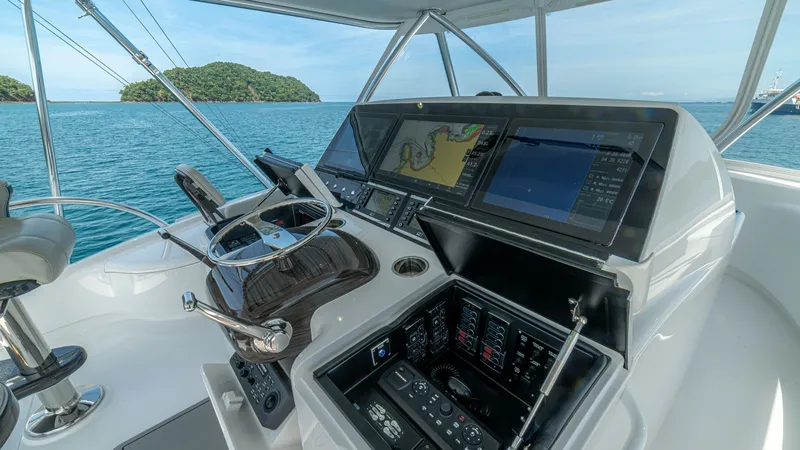 Slide: The Image of Flybridge Helm Station with Electronics The flybridge helm station of the 2024 Viking 64 Convertible boasts state-of-the-art navigation and control systems. Featuring multiple high-resolution displays and advanced electronic controls, this area is designed for optimal functionality and ease of - 7162590