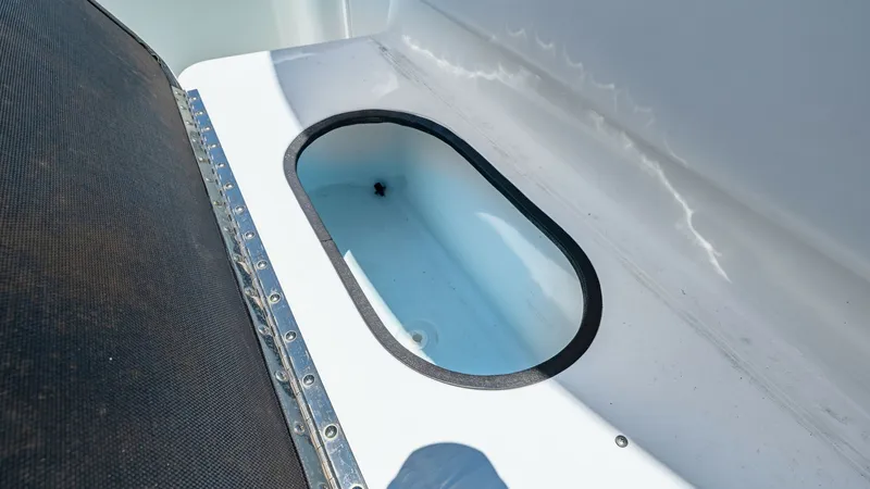 Slide: The Image of Livewell Compartment on Deck This image showcases the livewell compartment on the 2021 Yellowfin 36 Offshore. Designed for avid anglers, the livewell provides ample space and efficient aeration to keep bait lively. Its sleek, integrated design complements the vessel's deck layout, en - 7150883