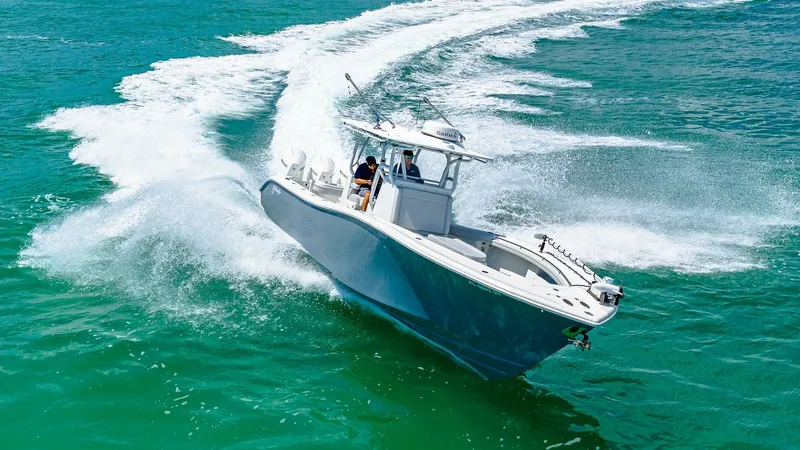 Slide: The Image of Dynamic Bow View in Motion The 2021 Yellowfin 36 Offshore cuts through the water with precision, showcasing its sleek bow design and robust performance. The image captures the boat's agility and power, with visible spray and wake highlighting its dynamic movement. This high-perform - 7150927