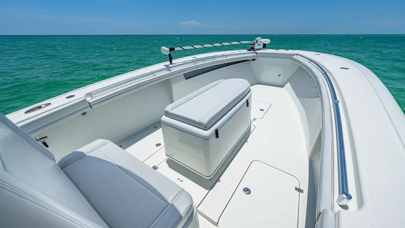 Slide: The Image of Spacious Bow Seating Area The 2021 Yellowfin 36 Offshore features a well-designed bow area with comfortable seating and ample storage. The cushioned bench offers a relaxing spot to enjoy the open sea views, while the integrated cooler enhances convenience for long trips. Sleek rai - 7150903