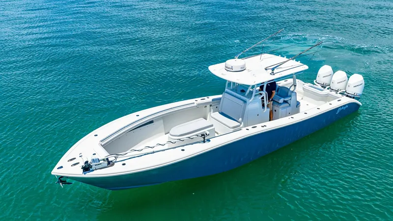 Slide: The Image of Aerial View of Center Console Deck This 2021 Yellowfin 36 Offshore features a spacious center console deck, offering ample seating and storage for optimal fishing and leisure activities. The sleek hull design ensures smooth navigation through various water conditions, while the triple outb - 7150878