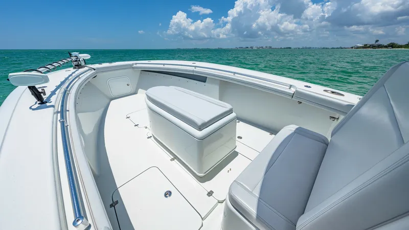 Slide: The Image of Spacious Bow Seating Area The 2021 Yellowfin 36 Offshore showcases a spacious bow seating area, perfect for relaxation and enjoying the open sea. The cushioned seats and center console storage offer comfort and convenience, while the sleek railings provide safety and style. Enjoy - 7150904