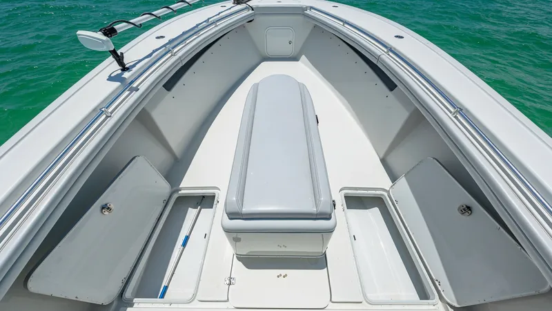 Slide: The Image of Bow Seating and Storage Area The bow of the 2021 Yellowfin 36 Offshore features a sleek, cushioned seating area with ample storage compartments on either side. The layout optimizes both comfort and functionality, ideal for relaxing or organizing gear. The smooth, white finish complem - 7150906