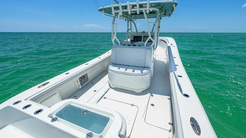Slide: The Image of Center Console Fishing Deck The 2021 Yellowfin 36 Offshore showcases a spacious fishing deck with a well-equipped center console. Featuring ample seating and rod holders, it's designed for optimal angling experiences. The sleek, open layout provides easy access to all areas, ensurin - 7150880