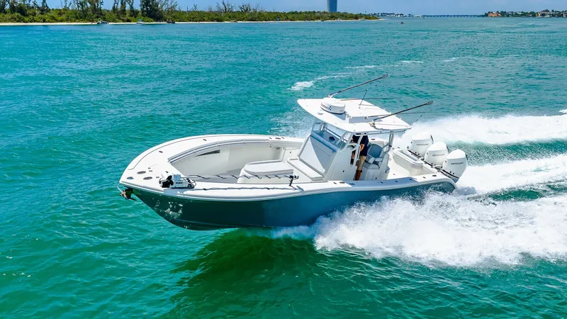 Slide: The Image of Yellowfin 36 Offshore in Motion The 2021 Yellowfin 36 Offshore cuts through the vibrant waters with precision and power, showcasing its sleek design. The spacious bow area offers ample seating and storage, ideal for both leisure and serious fishing expeditions. Equipped with robust outb - 7150925