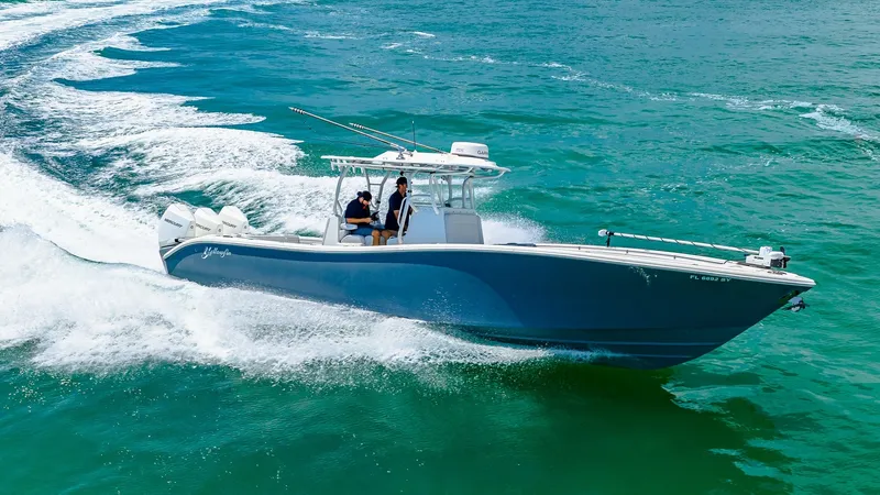 Slide: The Image of Yellowfin 36 Offshore in Action The 2021 Yellowfin 36 Offshore cuts through the water with precision and speed, showcasing its sleek hull design. This model is equipped with a center console, providing excellent visibility and control for the captain. Its spacious deck allows for ample - 7150928