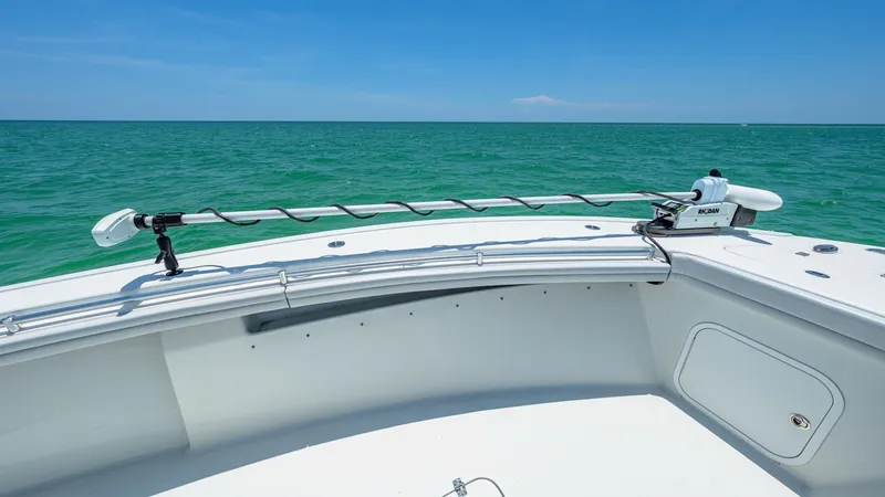 Slide: The Image of Bow Area with Trolling Motor The bow of the 2021 Yellowfin 36 Offshore showcases a sleek, open design perfect for fishing and leisure activities. Equipped with a high-performance trolling motor, this area ensures precise navigation and easy maneuverability. The clean lines and spacio - 7150905