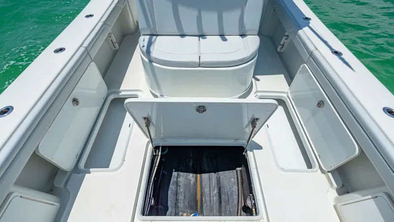 Slide: The Image of Forward Seating and Storage Area The forward section of the 2021 Yellowfin 36 Offshore features comfortable seating with ample storage options. The spacious bench seat offers a relaxing spot for passengers, while multiple storage compartments beneath the deck provide practical solutions - 7150898