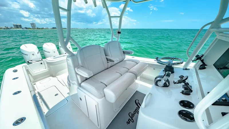 Slide: The Image of Helm and Seating Area The helm of the 2021 Yellowfin 36 Offshore features a sleek, modern design with state-of-the-art navigation equipment. Plush, ergonomic seating provides comfort for long journeys, while the open layout ensures easy movement and access to controls. The sur - 7150894