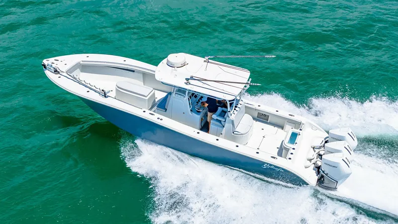 Slide: The Image of Aerial View of Center Console This 2021 Yellowfin 36 Offshore showcases a sleek center console design, ideal for serious anglers and recreational boaters alike. The spacious deck layout provides ample room for movement, while the triple outboard engines deliver powerful performance an - 7150930