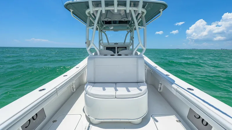 Slide: The Image of Spacious Bow Area with Seating The 2021 Yellowfin 36 Offshore features a spacious bow area with comfortable seating, ideal for relaxation and socializing. The robust T-top provides ample shade, while the well-crafted console ensures easy access to controls and navigation. This area emp - 7150886