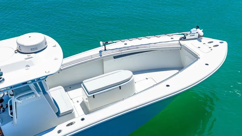 Slide: The Image of Spacious Bow Area with Seating The 2021 Yellowfin 36 Offshore features a sleek bow area designed for comfort and functionality. The spacious deck offers ample seating with a central storage compartment, perfect for fishing gear or personal items. The clean lines and high-quality finish - 7150875