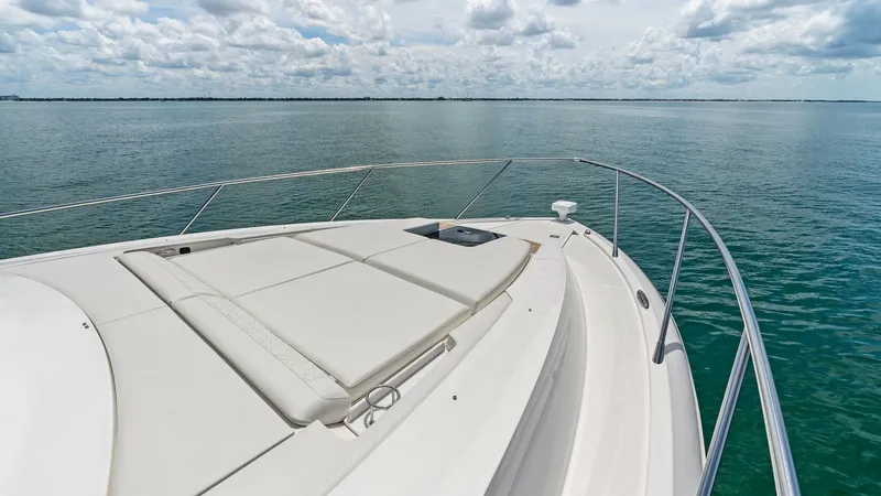 Slide: The Image of Spacious Bow Lounge Area This image showcases the expansive bow lounge area of the 2025 Tiara Yachts 48LE. Featuring luxurious sun pads, it provides a perfect spot for relaxation while enjoying panoramic ocean views. The sleek railing design adds both style and safety, enhancing - 7403620
