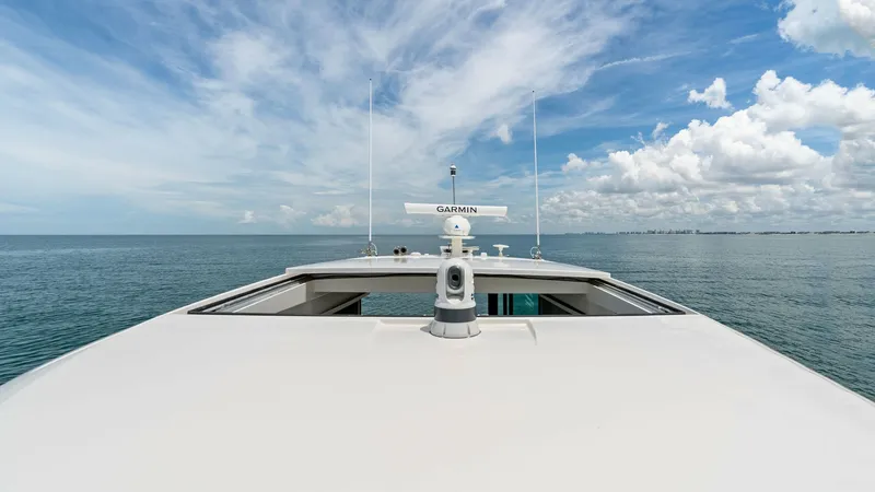 Slide: The Image of Bow View with Navigation Equipment This image showcases the sleek bow of the 2025 Tiara Yachts 48LE, highlighting its advanced Garmin navigation equipment. The expansive deck offers a clear, unobstructed view of the horizon, emphasizing the vessel's stability and design for open water crui - 7403623