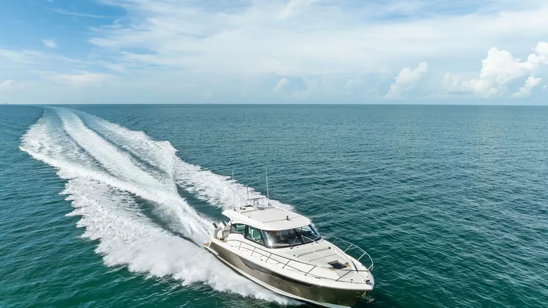 Slide: The Image of Aerial View of Tiara 48LE Cruising Experience the exhilaration of the Tiara 48LE slicing through open waters with grace and power. The sleek, modern lines of the hull are complemented by the expansive deck space, offering both luxury and performance. This image captures the yacht's superio - 7403669