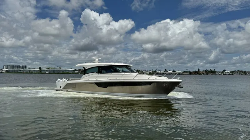 The Image of Profile View of Tiara 48LE This image showcases the sleek profile of the 2025 Tiara Yachts 48LE by Galati Yacht Sales. The vessel's elegant lines and modern design are highlighted, with a sturdy hardtop and expansive windows offering both style and functionality. The hull's smooth - 7179503