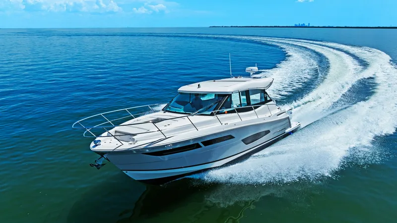 Slide: The Image of Dynamic Bow View in Motion Experience the thrill of the 2025 Regal 38 EXC as it gracefully slices through the water, showcasing its sleek and modern design. The bow's streamlined structure enhances both performance and aesthetic appeal, with ample deck space for relaxation and enjo - 7180486