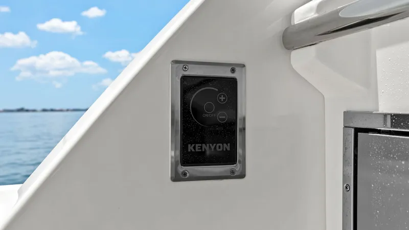 Slide: The Image of Outdoor Grill Control Panel This image showcases the sleek control panel for the Kenyon grill on the Regal 38 EXC. Mounted conveniently on the exterior, it offers intuitive controls for easy operation while enjoying the views. The polished finish complements the yacht's modern desig - 7180422