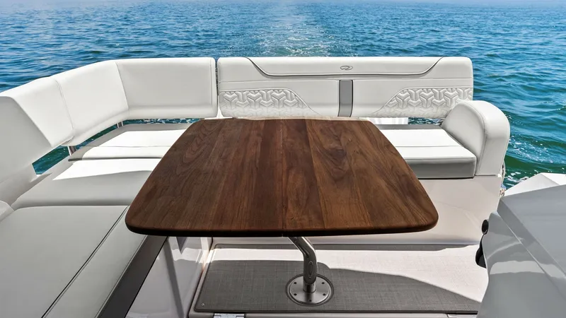 Slide: The Image of Aft Deck Seating Area This elegant aft deck features plush U-shaped seating with a beautifully crafted wooden table, perfect for al fresco dining or relaxing with a view. The high-quality upholstery and sleek design offer both comfort and style, enhancing the luxurious feel of - 7180418
