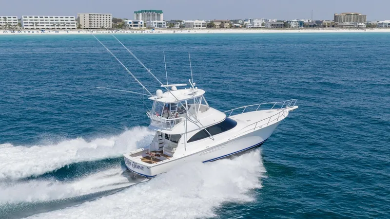 Slide: The Image of Viking 48 Convertible in Motion The 2021 Viking 48 Convertible gracefully slices through the water, showcasing its sleek design and robust performance. The flybridge offers commanding views, while the spacious aft deck is perfect for fishing or leisure. This vessel embodies the perfect - 7224919