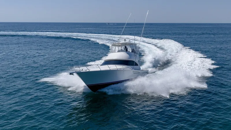 Slide: The Image of Dynamic Bow View at Sea The Viking 48 Convertible 'High Impact' glides effortlessly through open waters, showcasing its sleek bow and powerful performance. The vessel's cutting-edge design is evident in the robust hull and sharp lines, ensuring both speed and stability. Ideal fo - 7224918