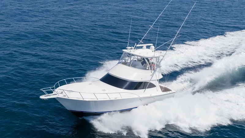 Slide: The Image of Dynamic Aerial View of Viking 48 The Viking 48 Convertible cuts through the water with precision and power, showcasing its sleek, aerodynamic design. The spacious flybridge offers excellent visibility and comes equipped with advanced navigation systems. Its robust hull and elegant lines - 7224917