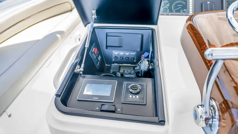 Slide: The Image of Flybridge Instrument Console This image showcases the flybridge instrument console of the 2021 Viking 48 Convertible. The console features advanced navigation and communication tools, all neatly arranged for easy access. The high-quality materials and ergonomic design ensure function - 7224897