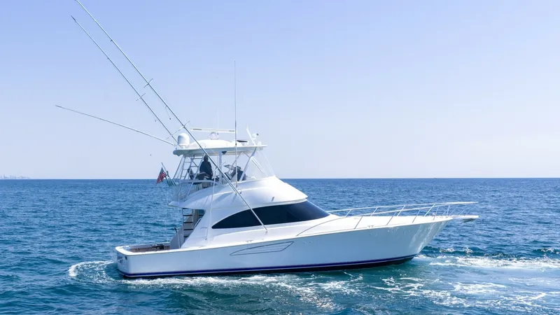 Slide: The Image of Profile View of Viking 48 Convertible This image showcases the sleek profile of the 2021 Viking 48 Convertible, highlighting its superior craftsmanship and design. The vessel's aerodynamic lines and sturdy fishing tower are built for both performance and luxury. Its sweeping bow and spacious - 7224849