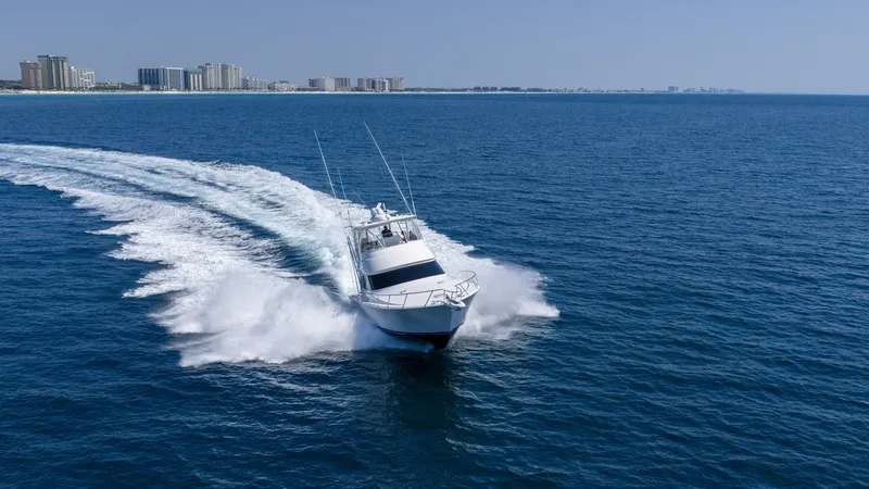 Slide: The Image of Aerial View of Viking 48 Convertible Experience the exhilarating performance of the 2021 Viking 48 Convertible as it cuts through the open water with precision. The sleek hull design and powerful engines create an impressive wake, showcasing its exceptional speed and handling. This vessel pe - 7224915