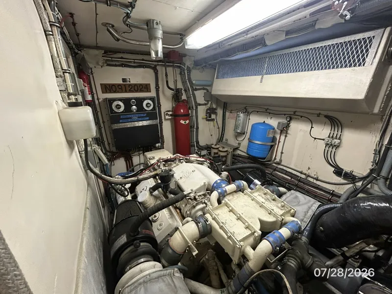Slide: The Image of 54' Hatteras starboard engine room forward - 7288153