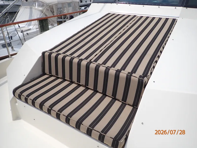 Slide: The Image of 54' Hatteras foredeck seating-sunpad - 7288063