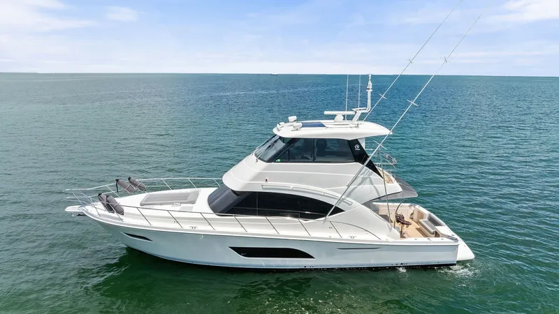 Slide: The Image of Side Profile of Riviera 57 Enclosed Bridge This image showcases the sleek side profile of the 2021 Riviera 57 Enclosed Bridge, highlighting its elegant design and spacious layout. The enclosed flybridge offers excellent visibility and protection, while the expansive aft deck provides ample space f - 7541540
