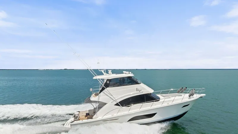 Slide: The Image of Side View of Riviera 57 in Motion This dynamic image showcases the 2021 Riviera 57 Enclosed Bridge gliding effortlessly through open waters. The sleek hull design and powerful engine create an impressive wake, highlighting the yacht's performance capabilities. The enclosed bridge offers a - 7541547