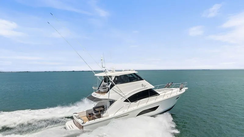 Slide: The Image of Dynamic Starboard View in Motion The 2021 Riviera 57 Enclosed Bridge is captured in motion, showcasing its sleek starboard profile cutting through the water. The enclosed bridge offers panoramic views and protection from the elements, while the spacious aft deck provides ample space for - 7541548