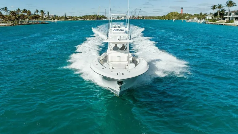 Slide: The Image of Bow View Cruising on Open Water The 2019 Invincible 42 Open Fisherman, Ohana, is captured cruising gracefully through vibrant blue waters. Its sharp bow design ensures a smooth and efficient ride, cutting seamlessly through the waves. The spacious deck offers ample room for fishing and - 7285538