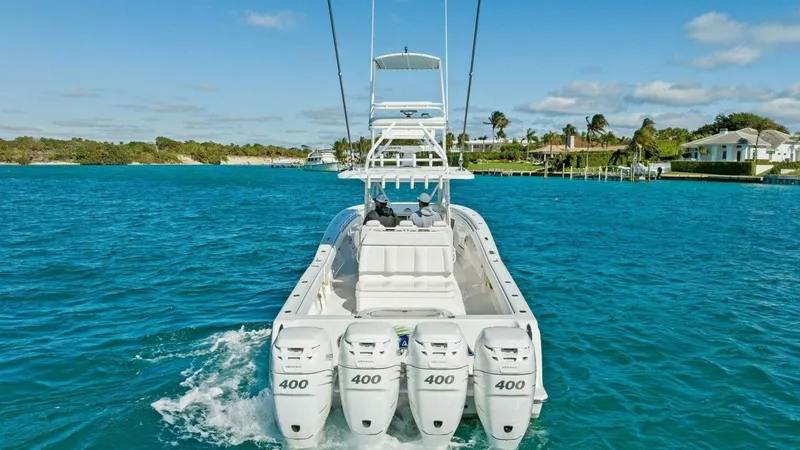 Slide: The Image of Stern View with Quad Outboards This image showcases the powerful stern of the 2019 Invincible 42 Open Fisherman, featuring four high-performance 400 horsepower outboard engines. The spacious aft deck is designed for both fishing and leisure, providing ample space for movement and equip - 7285542