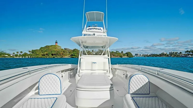 Slide: The Image of Spacious Bow Seating Area This image showcases the inviting bow seating area of the 2019 Invincible 42 Open Fisherman, 'Ohana'. The expansive layout features comfortable, diamond-stitched cushions, designed for relaxation and socializing. The elevated tower offers enhanced visibil - 7285504