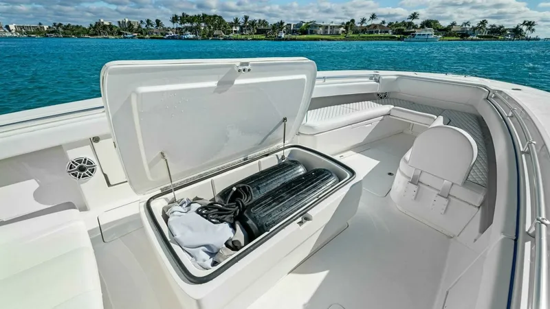 Slide: The Image of Forward Deck with Storage Compartment The forward deck of the 2019 Invincible 42 Open Fisherman showcases a spacious storage compartment, ideal for stowing gear and equipment. The area is designed with sleek, durable finishes, enhancing both functionality and aesthetic appeal. Ample seating a - 7285515