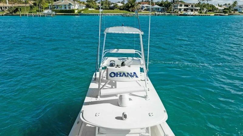 Slide: The Image of Bow with T-Top and Electronics The 2019 Invincible 42 Open Fisherman's bow showcases its sleek design and sturdy T-top, providing ample shade and protection. The spacious deck is equipped with advanced electronics, enhancing navigation and fishing capabilities. The pristine white finis - 7285535