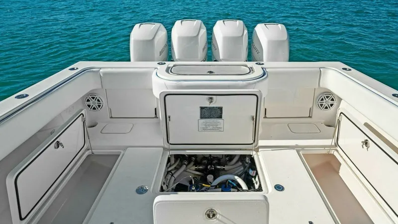 Slide: The Image of Stern Fishing Deck with Storage The aft deck of the 2019 Invincible 42 Open Fisherman showcases a well-designed fishing area equipped with ample storage compartments and access to essential systems. The spacious layout is ideal for serious anglers, with easy access to the water and buil - 7285525