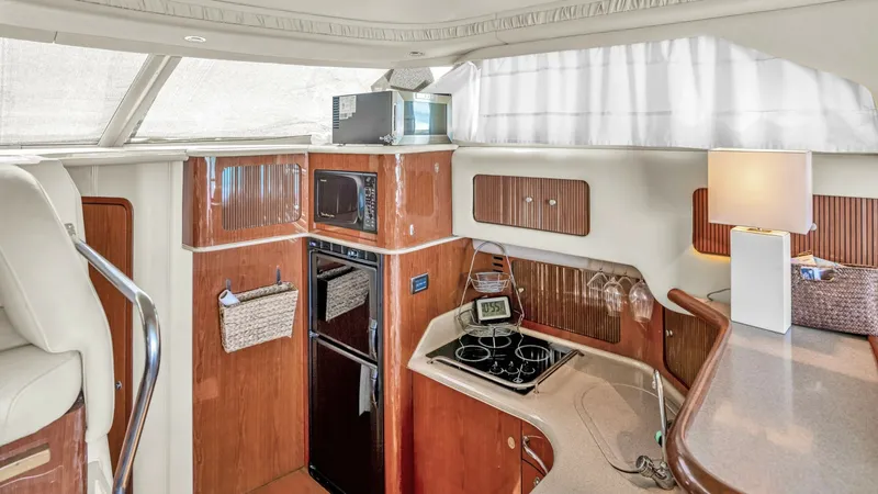 Slide: The Image of 2000 40 Sea Ray 400 Sedan Bridge Barely Covered Galley - 7285488
