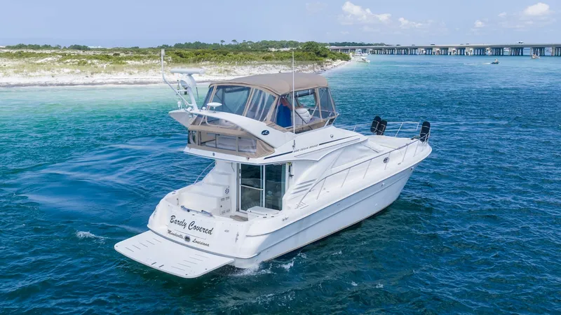 Slide: The Image of 2000 40 Sea Ray 400 Sedan Bridge Barely Covered Stern - 7285501