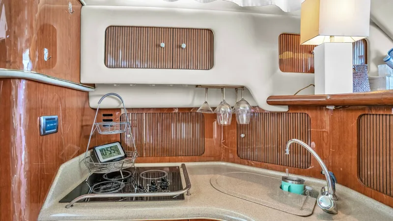 Slide: The Image of 2000 40 Sea Ray 400 Sedan Bridge Barely Covered Galley (2) - 7285486