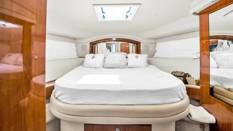 Slide: The Image of 2000 40 Sea Ray 400 Sedan Bridge Barely Covered Forward Stateroom - 7285489