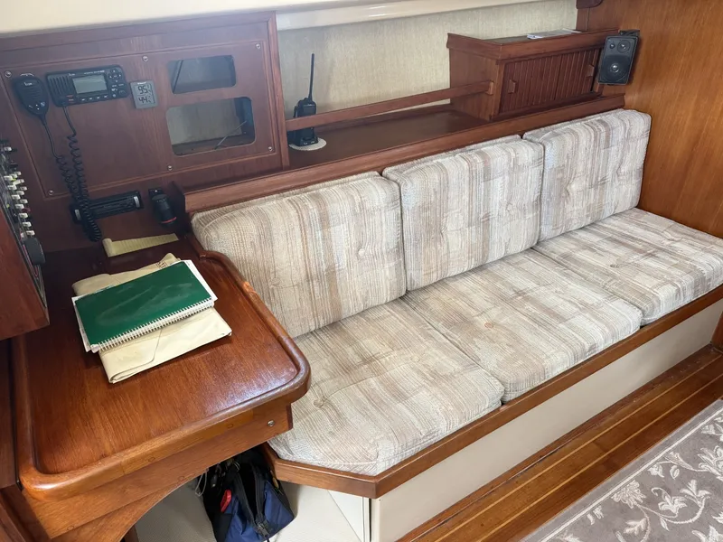 Slide: The Image of 1990 Island Packet 35 Port Settee and Nav Station - 7309483